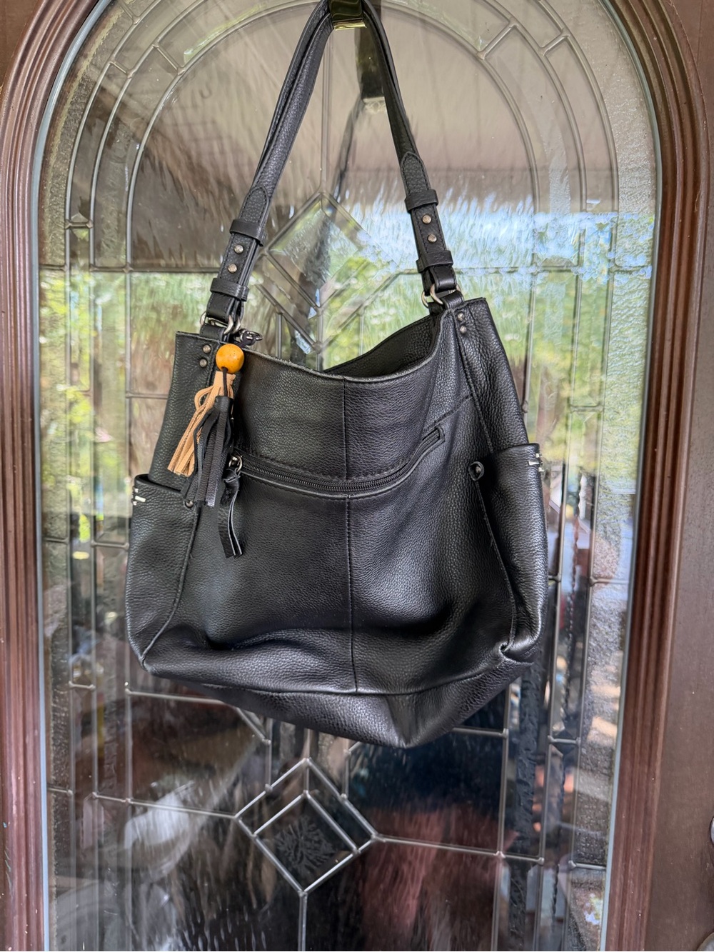 Black Pebbled Leather Shoulder Bag with Tassel Accent